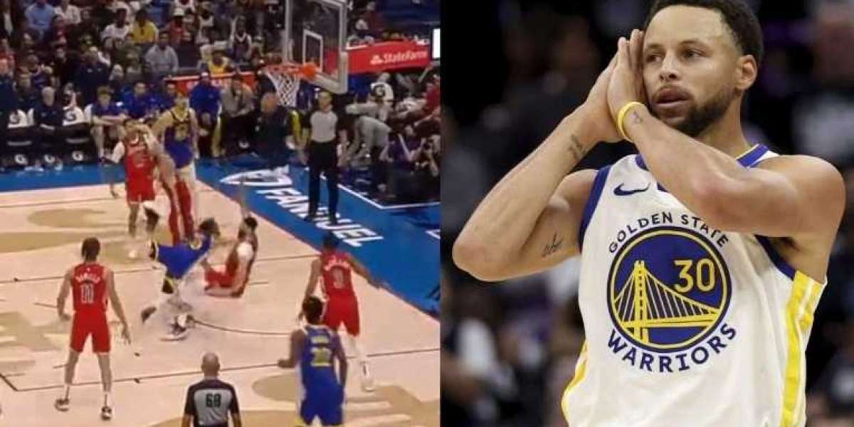 Stephen Curry makes a wild layup after bumping into Larry Nance Jr.